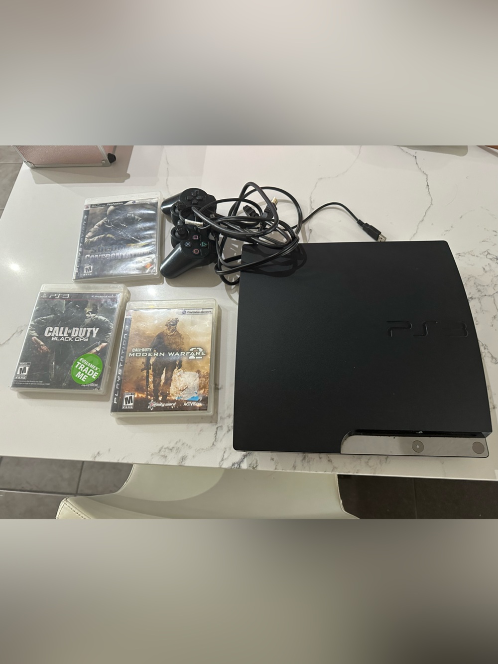Sony Black PS3 Slim Console with Wired DualShock Controller and Game Discs - Picture 3 of 11